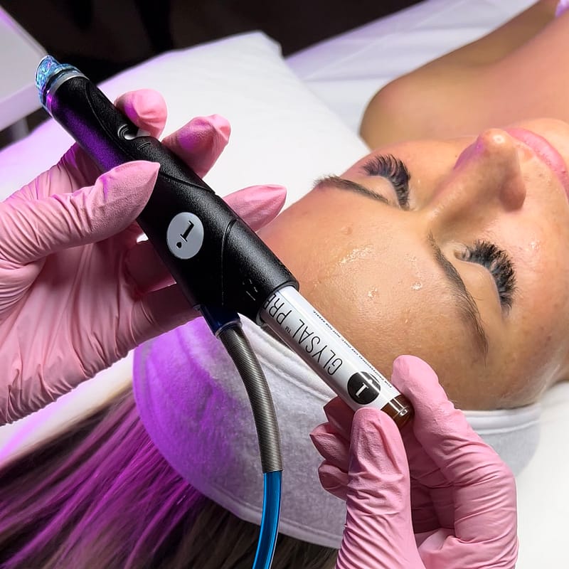 An image of a patient undergoing a Hydrafacial Booster Serum, a service offered at Bloom Health.